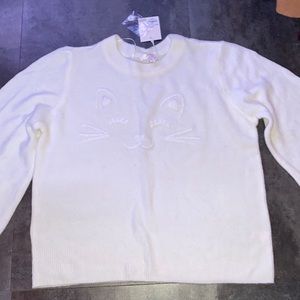 white cat sweater